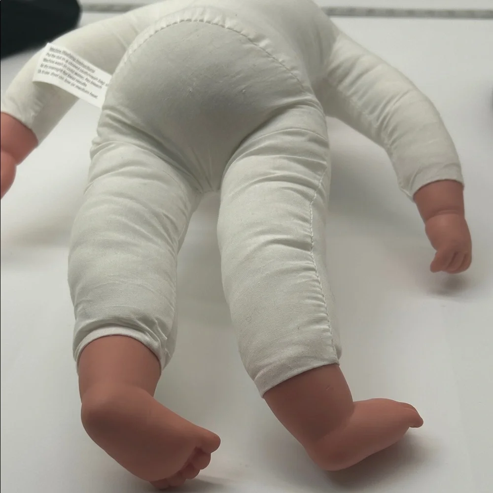 Realistic Baby Doll with White Outfit